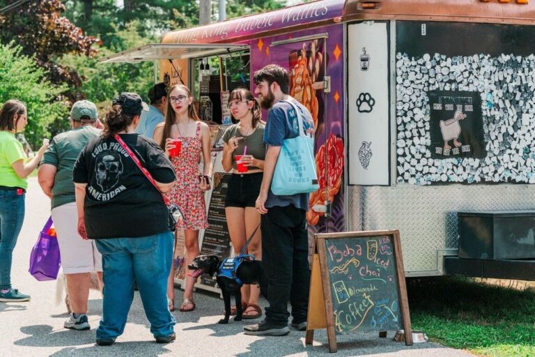 People gather around a food truck at Woofstock.