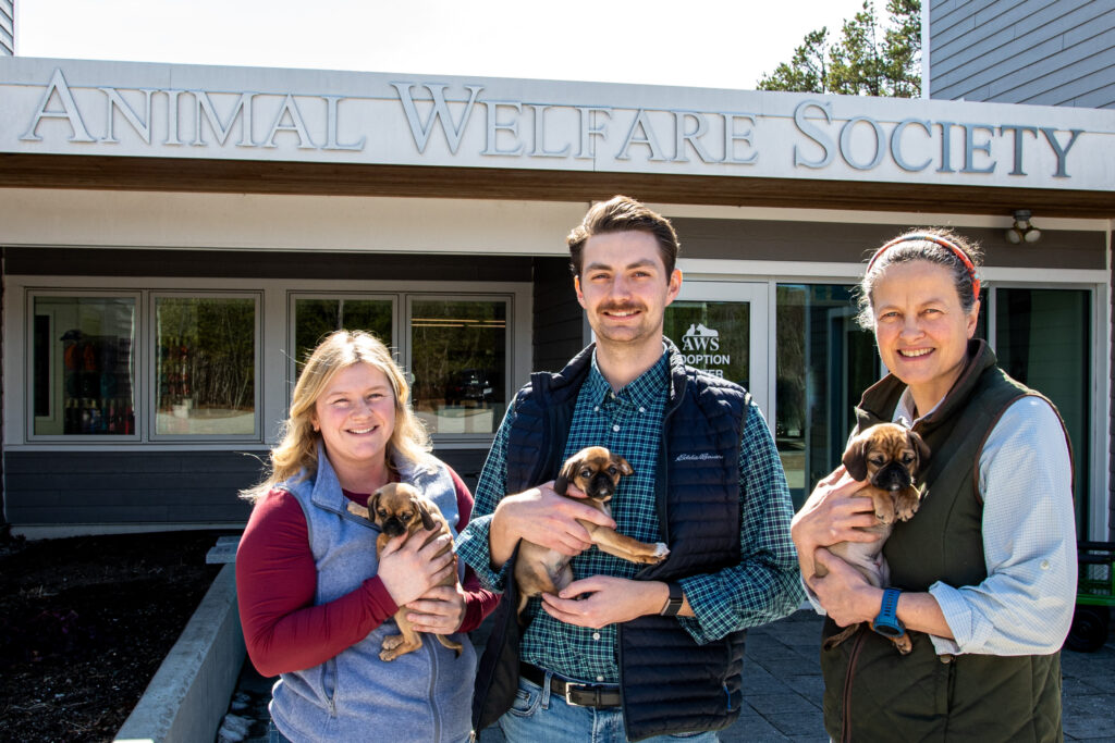 three new team members are welcomed to AWS in front of Animal Welfare Society
