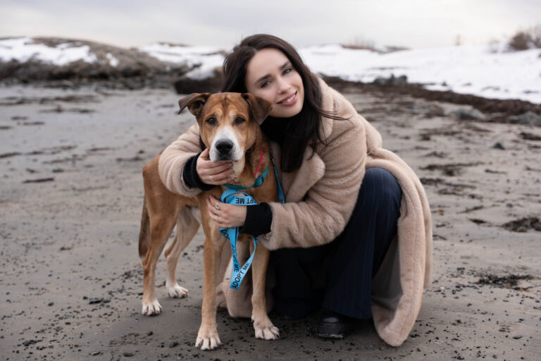 Austin the dog, seen here snuggling his dog date, shares his recipe for happiness.